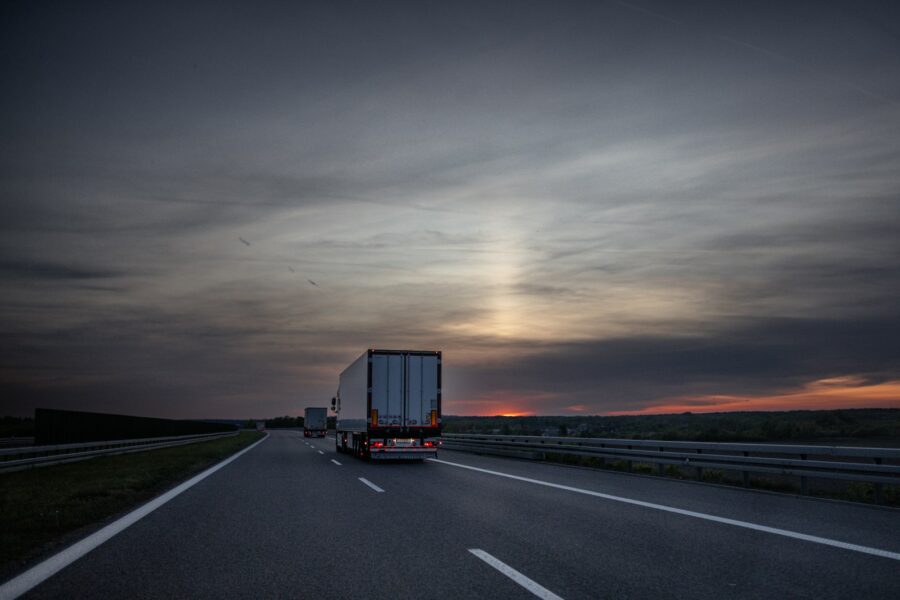 Modern semi truck highway sunset