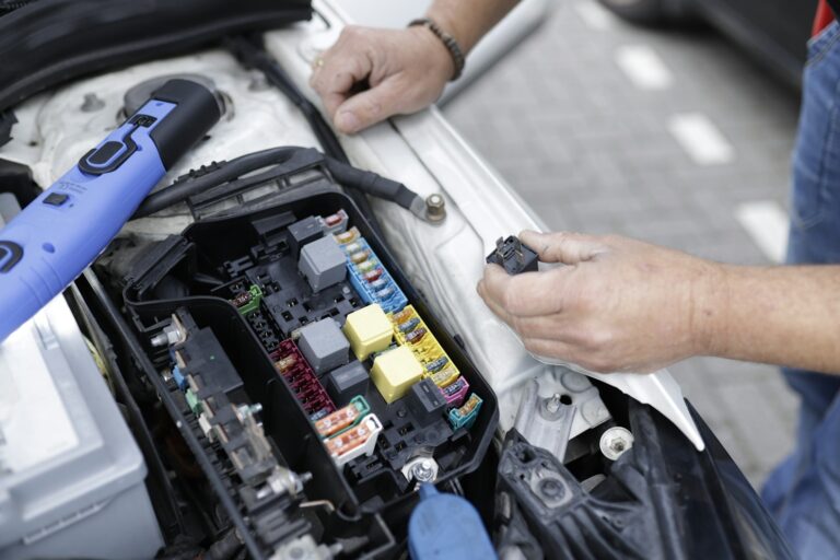 Mechanic inspecting battery diagnostics