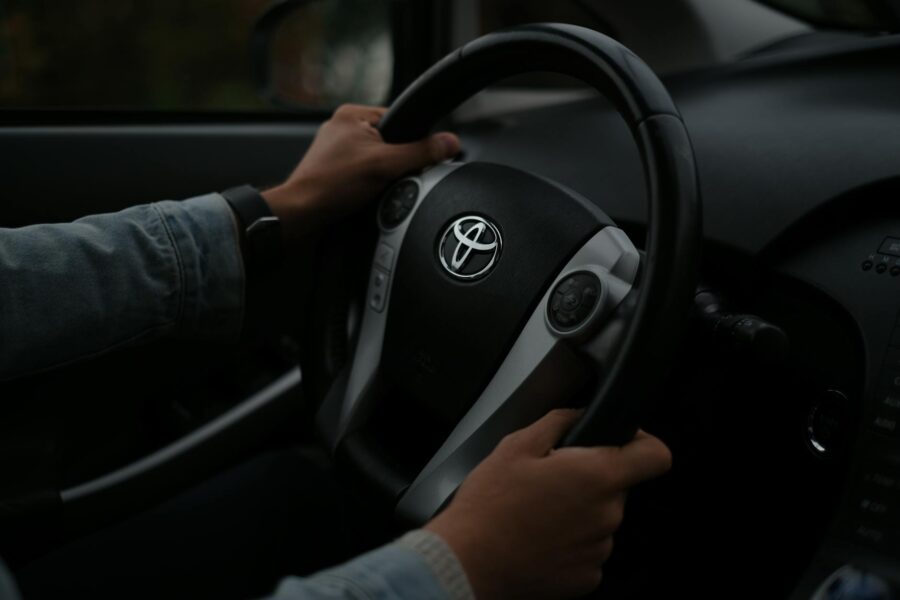 Dashboard battery icon closeup steering wheel