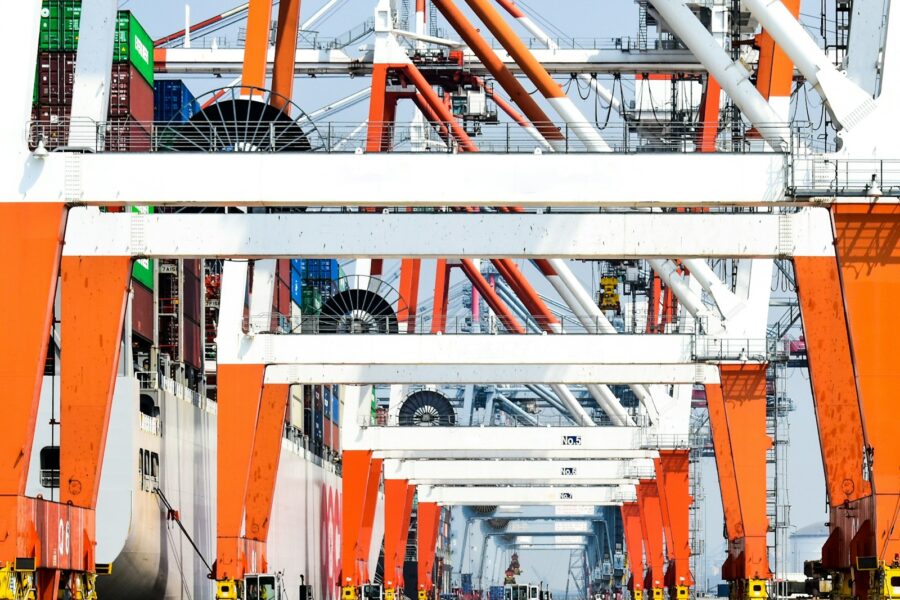 Electric cars cargo ship port cranes
