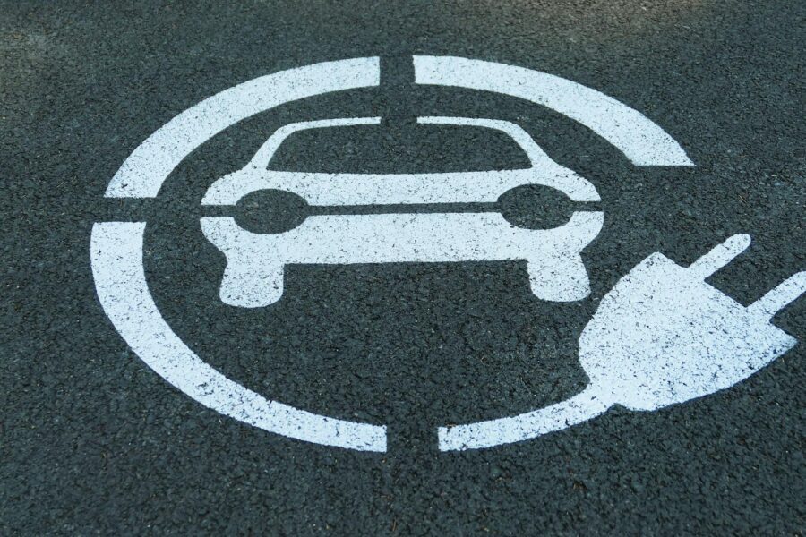 Electric car tire close-up asphalt road