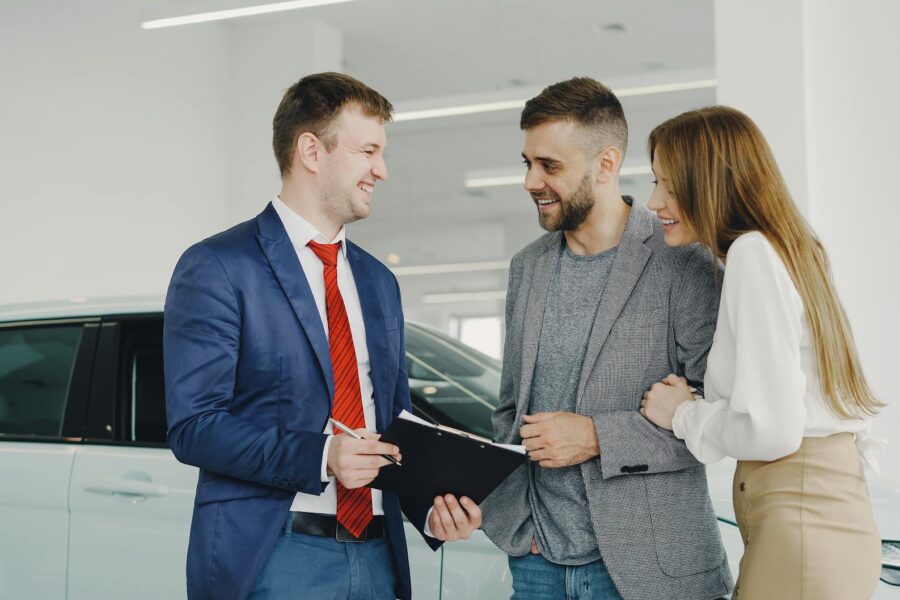Electric car warranty paperwork dealership desk