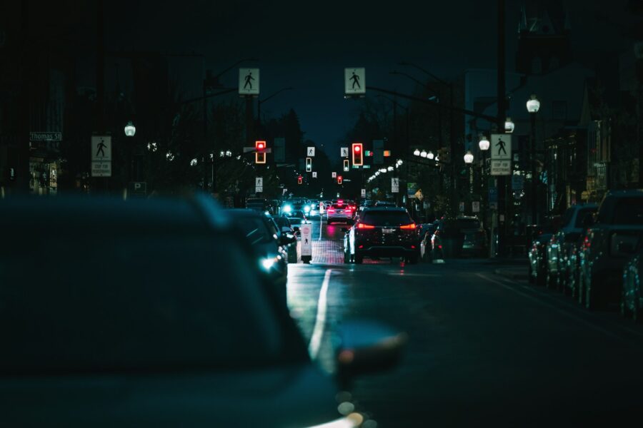 Electric car charging station city street evening