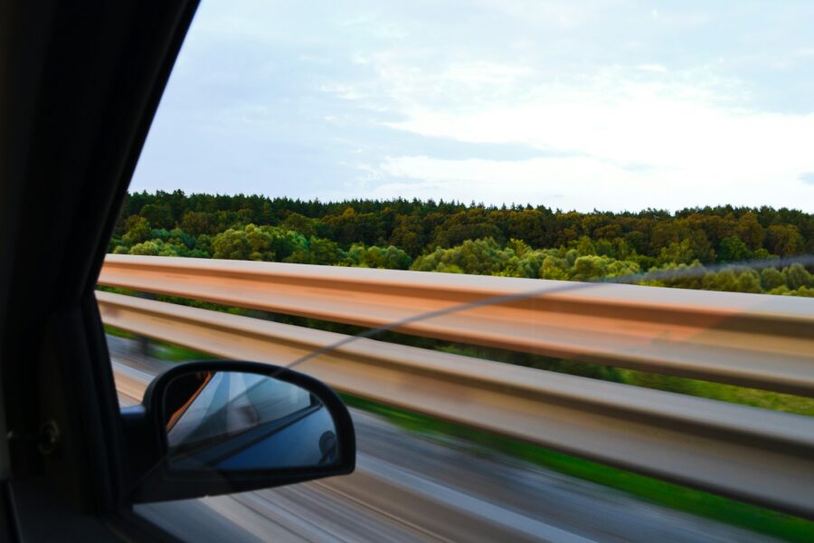 Electric car highway summer road trees