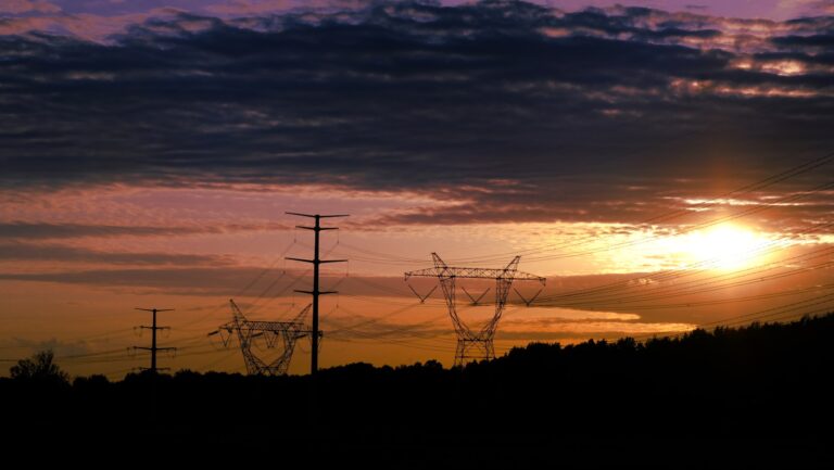 Neighborhood power lines transformers sunset