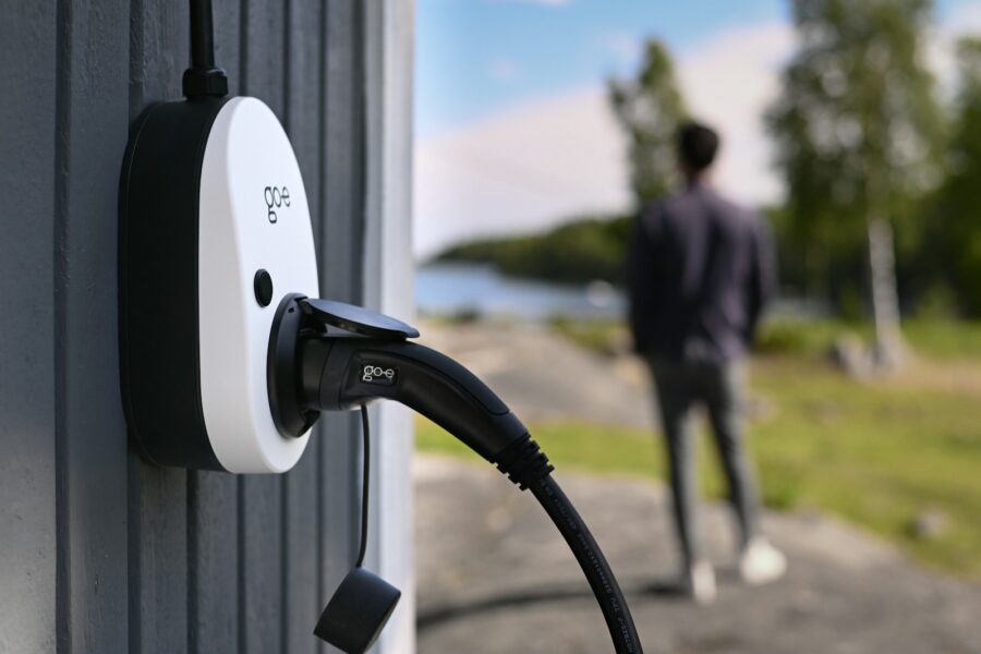 Suburban driveway home charger evening