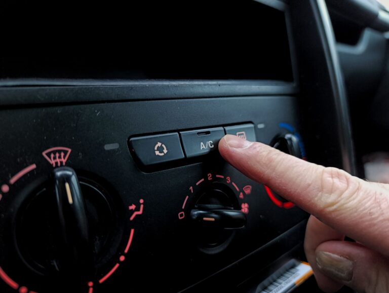 Driver adjusting climate